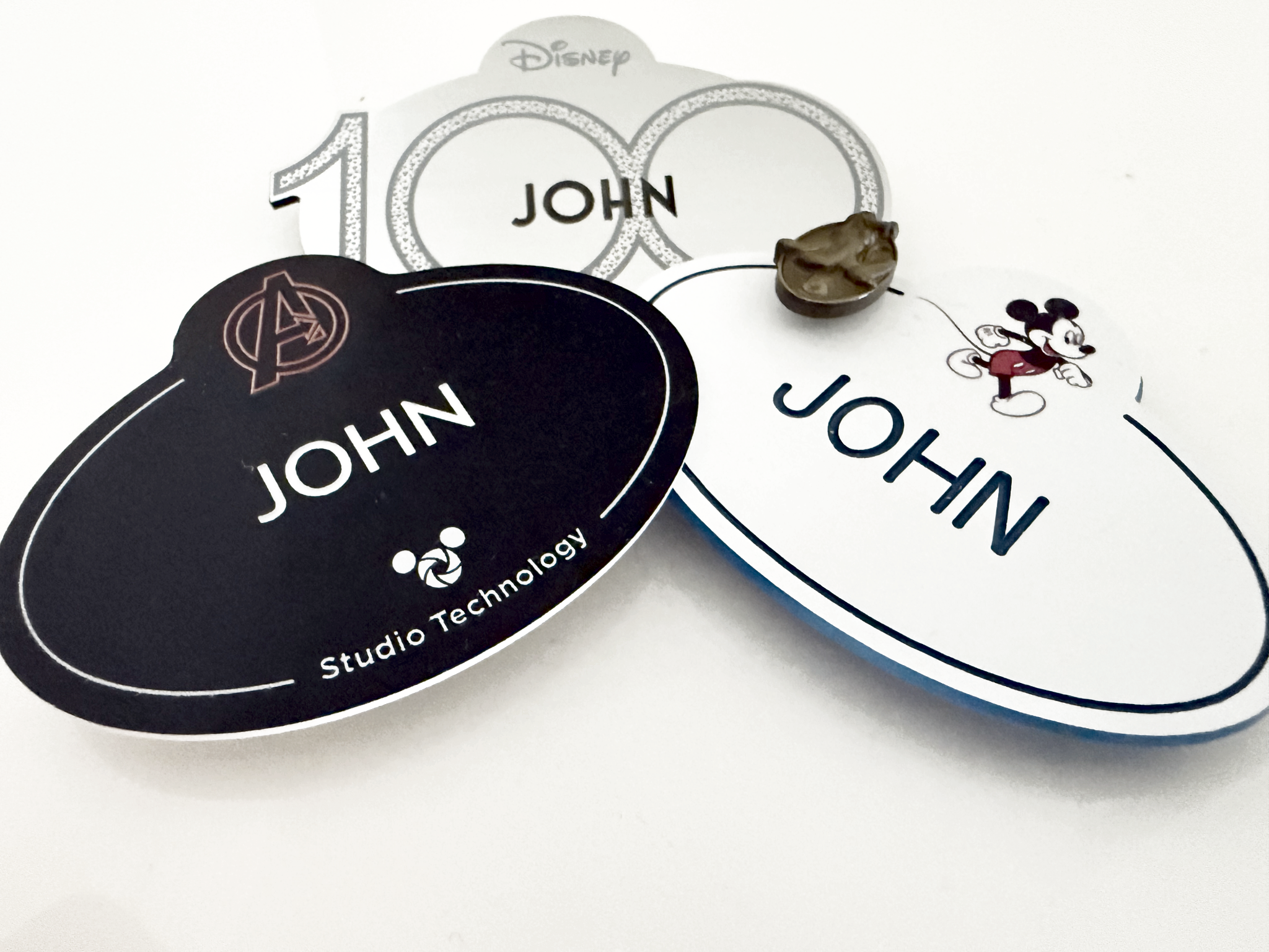 A collage of Disney Studios access badges from different roles and years, representing a long and meaningful career chapter.